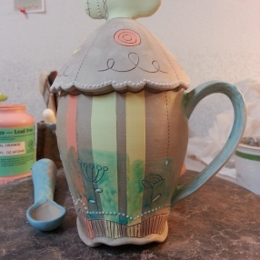 Decorated mug with lid (wax resist is the blue stuff).